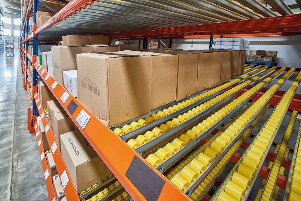 Closeup of the wheels on carton flow racks for picking